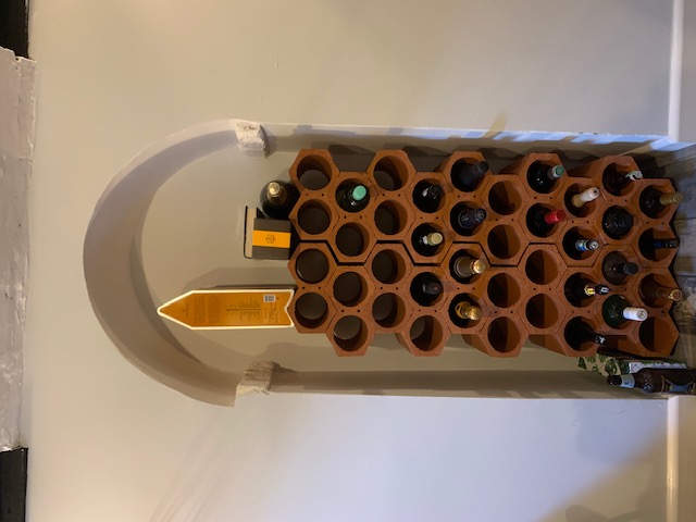 Wine racks in stone arched alcove