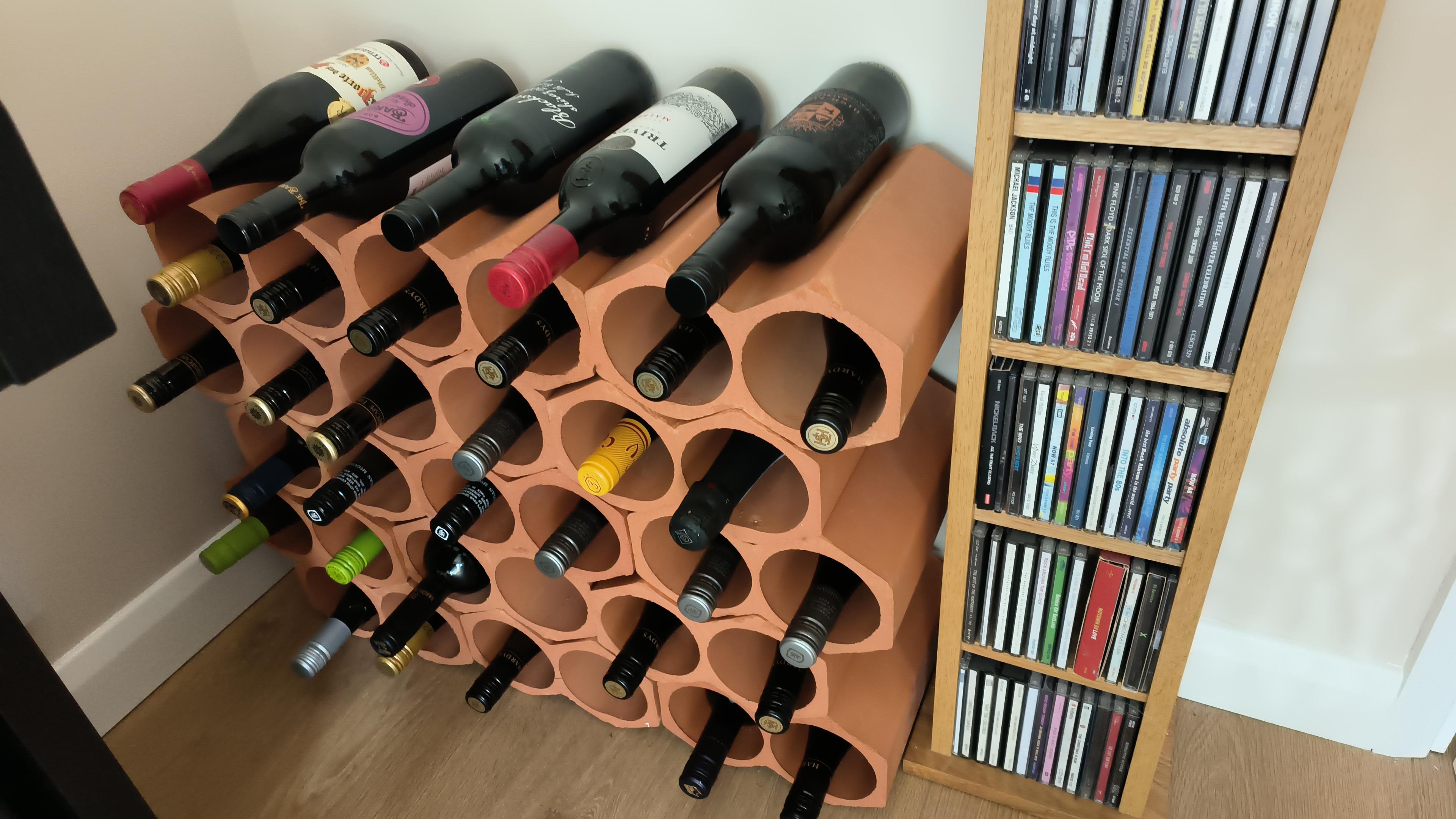 Wine racks alongside CD shelf