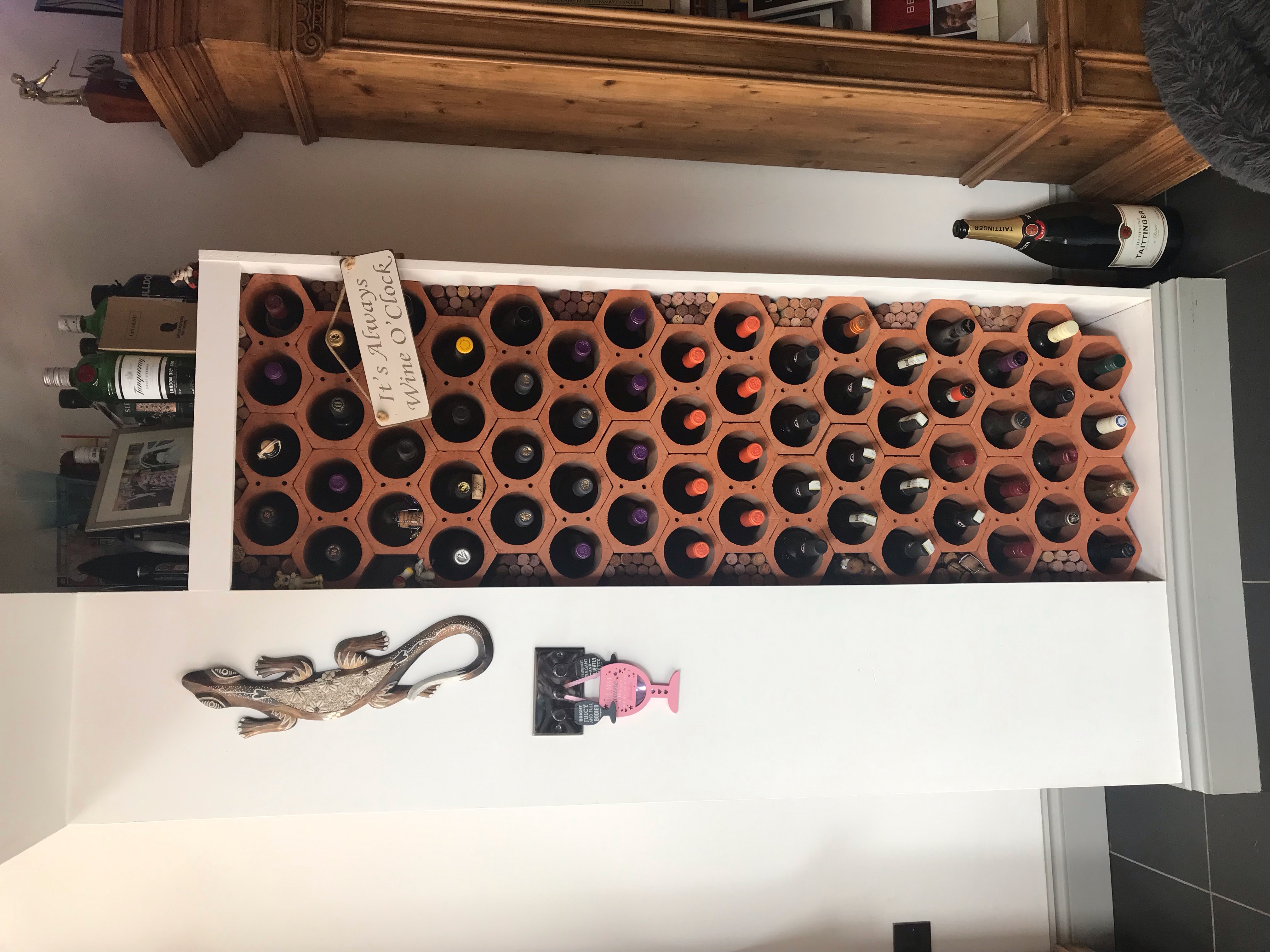 Built-in wine rack installation with Wine O Clock sign