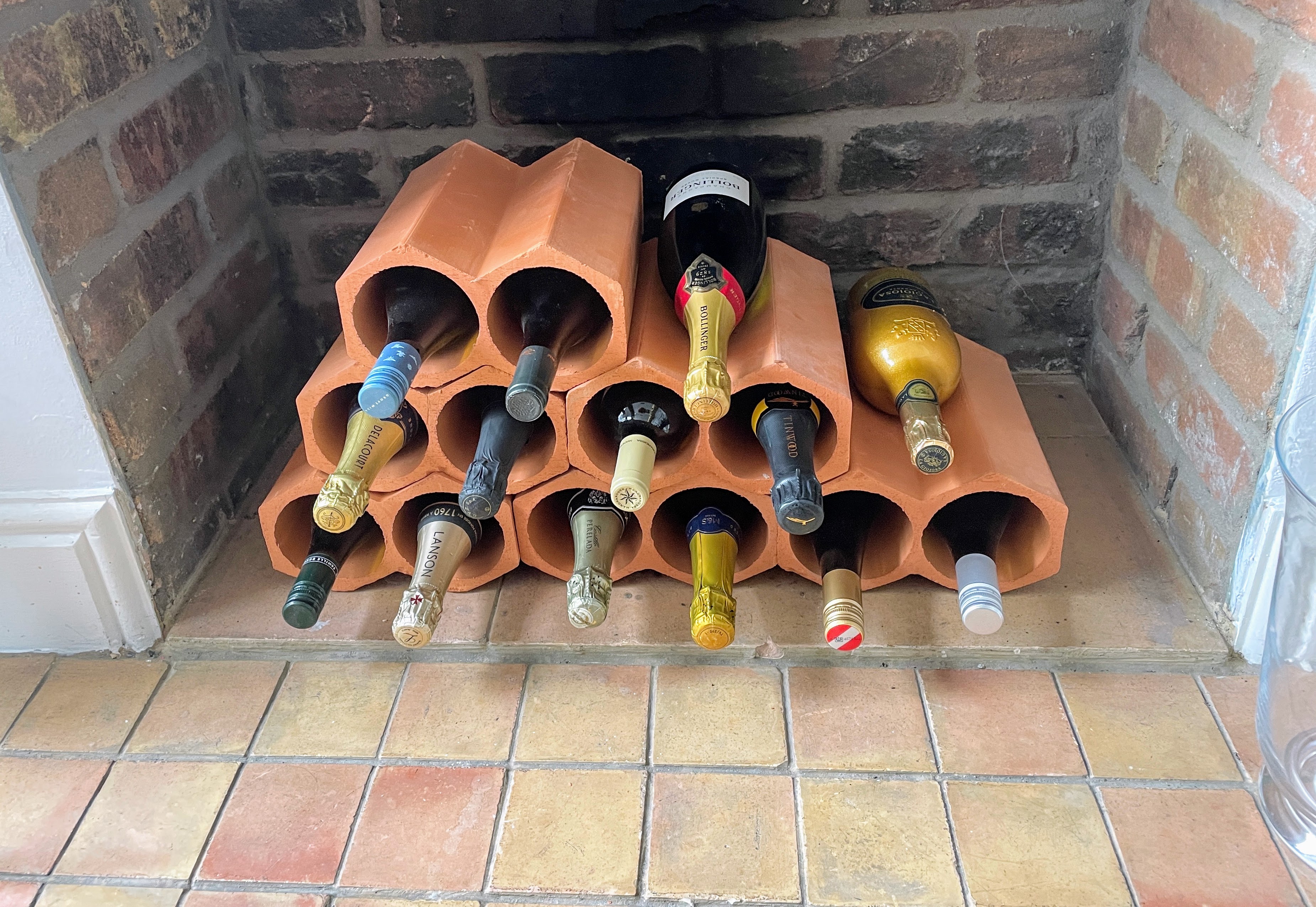 Fireplace alcove with exposed brick backdrop