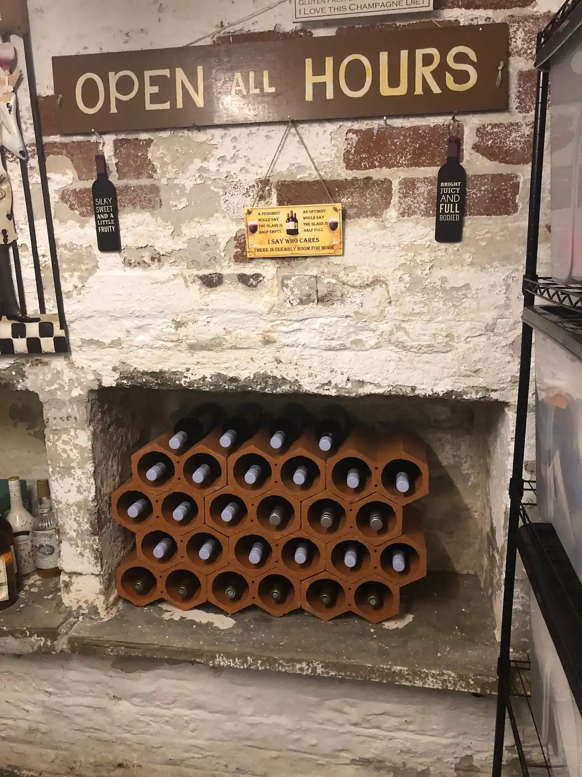 Terracotta wine racks in cellar fireplace